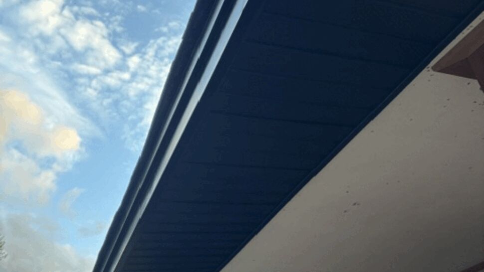Black gutters and soffit on house overhang