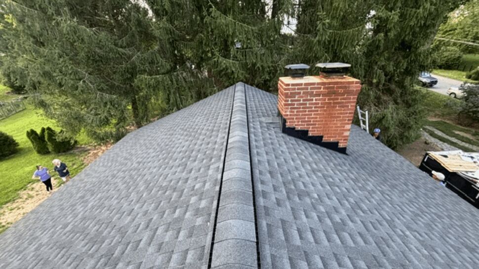 Ridge view with chimney and new grey shingles