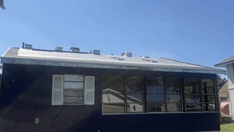 Roof with underlayment and shingle bundles staged for installation