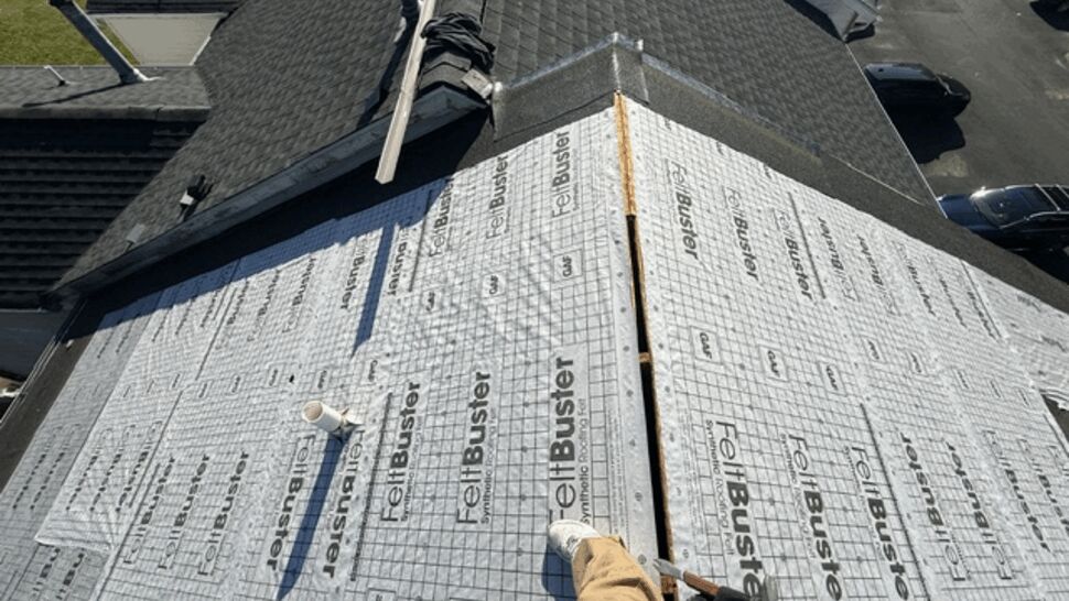 Synthetic underlayment installed across a sloped residential roof.