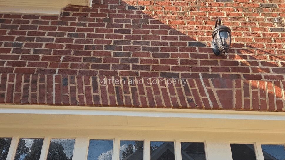 Brick Garage Facade with Gutters | Mitten & Company Brick facade above garage with gutter and lantern light