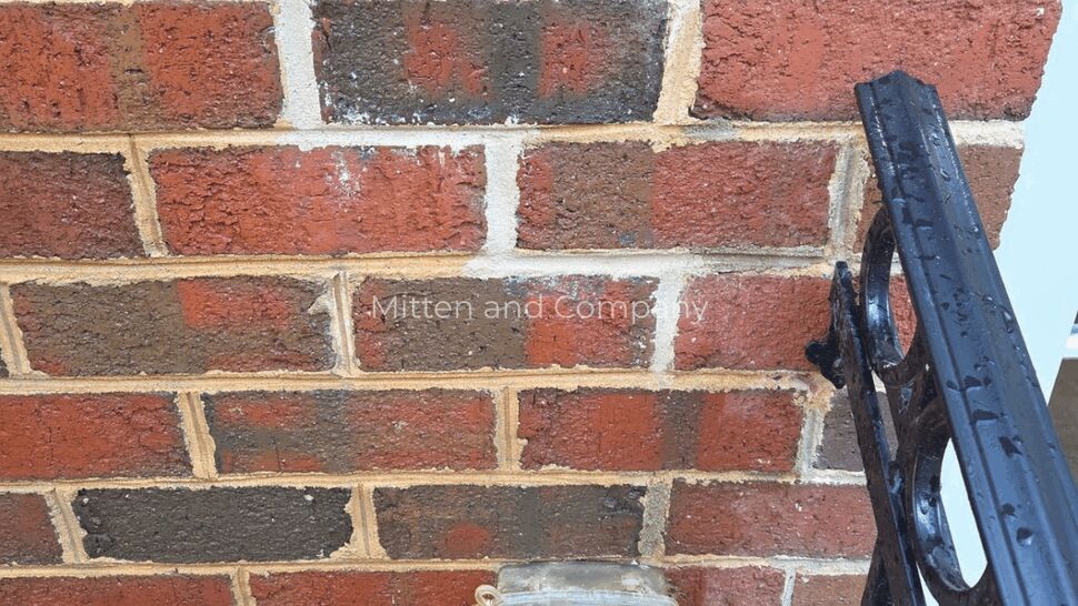 Brick Wall Close-up for Storm Damage Assessment | Mitten & Company Close-up of brick wall with service box and mortar staining