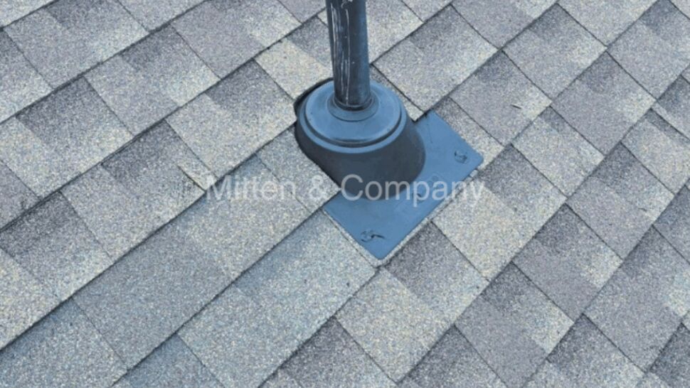 Shingle roof with a plumbing vent and flashing detail