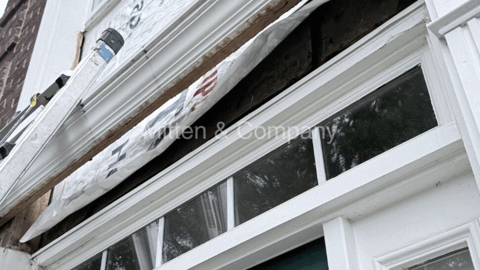 Torn weather wrap and exposed gap under window sill