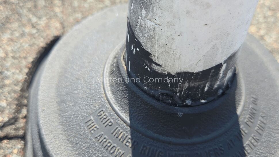 Close-up Roof Vent Boot Inspection | Mitten & Company Close-up of roof vent boot base and white pipe showing textured rubber and stamped instructions