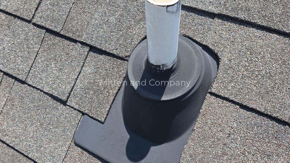 Roof Vent with T-Style Flashing | Mitten & Company Wide view of roof vent pipe with T-style flashing boot on asphalt shingles