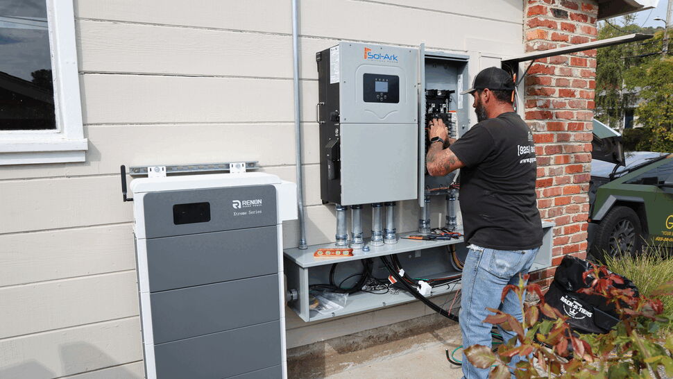 Inverter and Panel Installation | Green Air Heating & Air Conditioning Inc Close view of outdoor inverter and electrical panel being installed on home exterior