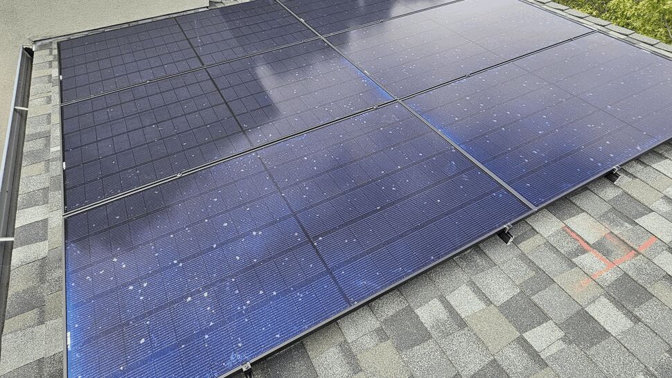 Close-up view of solar panels showing panel surface and mounting hardware