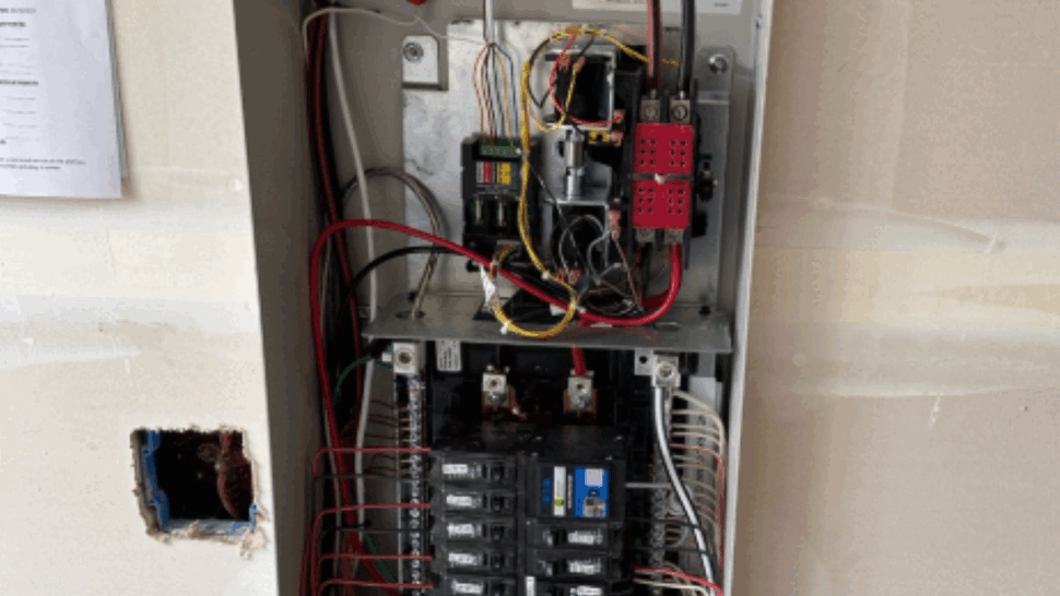 Whole-house backup power transfer switch and electrical panel setup Interior wiring of a Generac automatic transfer switch for a whole-home backup generator system in Issaquah, WA.