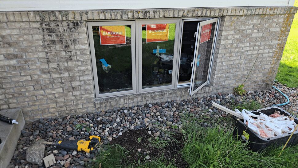 Basement triple-window installation | Lutgen Companies New triple-pane replacement windows with tan frames installed in Big Lake, MN