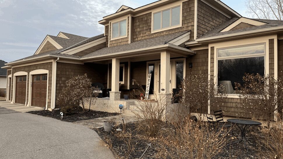 Front Porch with Brown Shake Siding | Lutgen Companies Front porch with bay window and brown shake siding