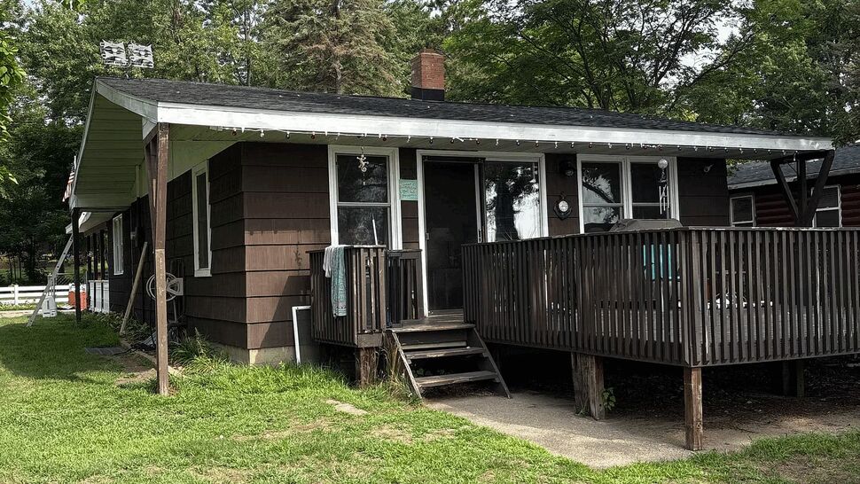 Front Porch Deck and Steps Inspection | Lutgen Companies Close view of brown house porch deck with steps and railing