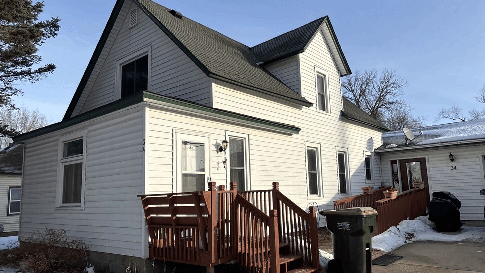 Before picture of a New GAF Timberline HDZ shingle roof with new fascia and seamless gutters with LeafFree gutter guards on a home in Kimball, MN