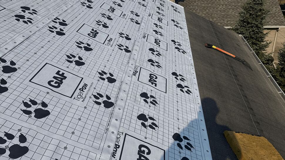Roof deck with GAF underlayment and stacked shingle bundles
