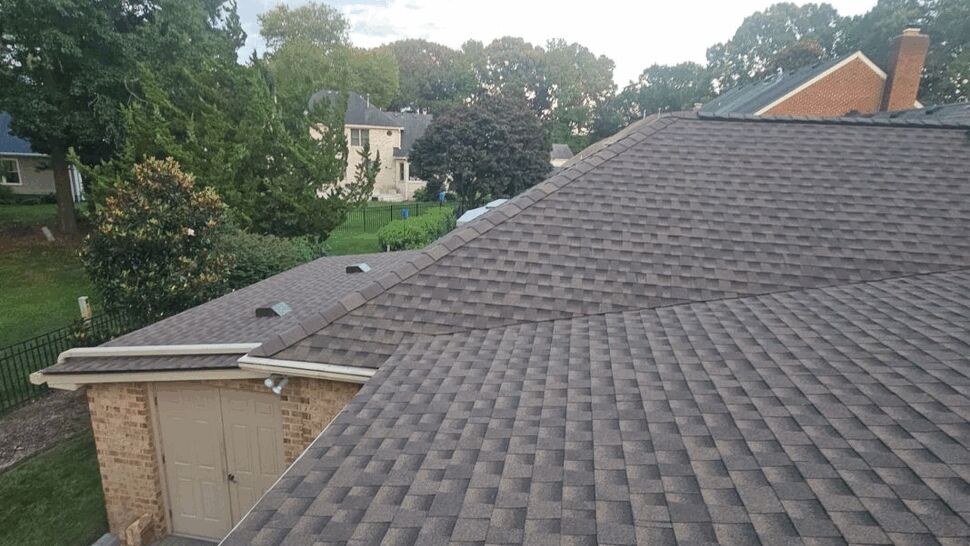 Back Roof Overview with Timberline Shingles | Exterior Source Virginia Wide rear roof view with patterned Timberline shingles and capped ridge
