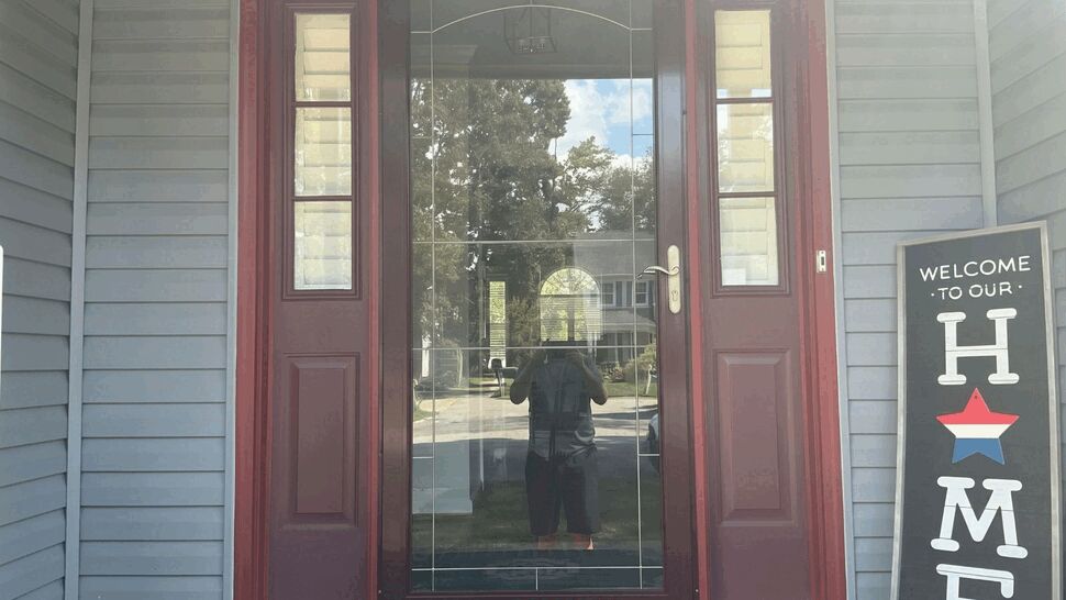 Burgundy front door with clear glass and narrow sidelights