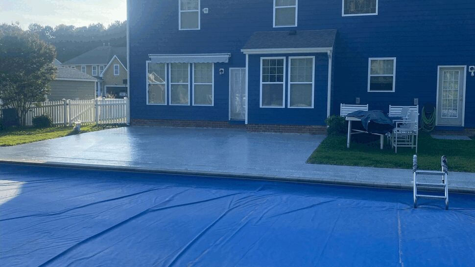 Backyard patio and pool coating | Exterior Source Virginia Backyard patio and covered pool with blue house in background