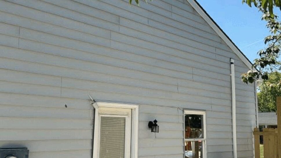 Side entry door and siding update | Exterior Source Virginia Side entry door on light gray horizontal siding with HVAC unit and small concrete pad.