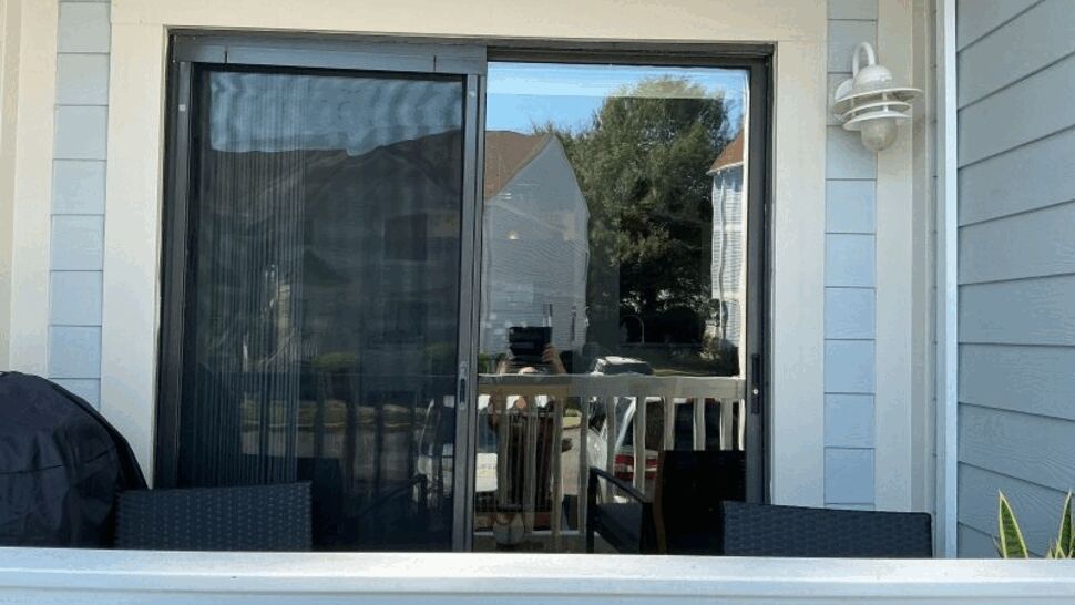 Sliding glass patio door opening onto a deck