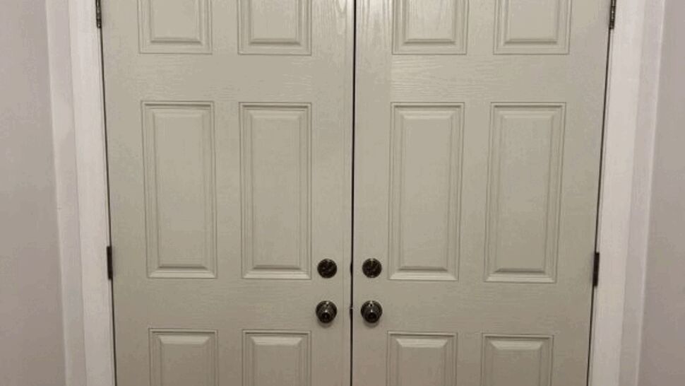 Solid double paneled entry doors | Exterior Source Virginia Pair of solid white double entry doors with raised panels and knob hardware