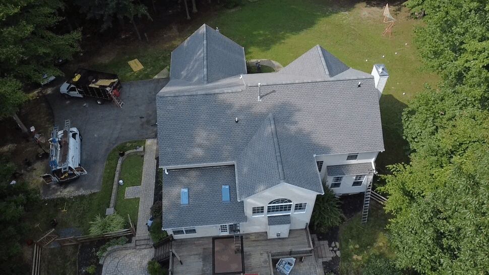 Residential Roof Inspection and Storm Assessment | Wells Home Improvements Top view of a residential roof and backyard during a professional roof inspection.