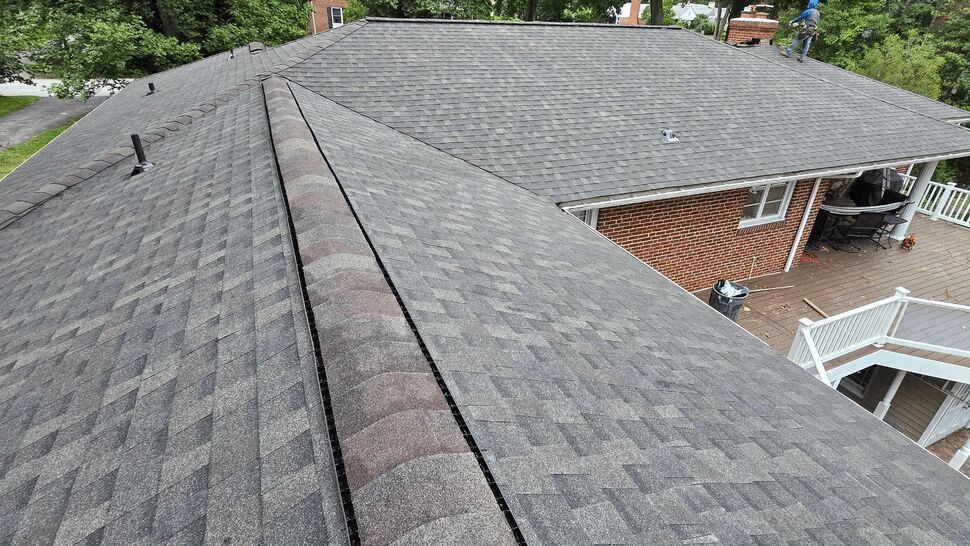 Roof Overlooking Deck and Porch | Wells Home Improvements Aerial view of roof ridge overlooking backyard deck and porch area