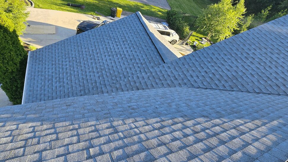 Aerial view of shingle roof valley and intersecting roof planes
